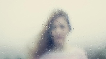 A blurred image of a woman