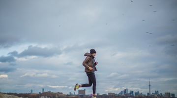 Person running on a cloudy day