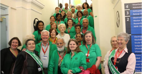 Group of Friends of Moorfields volunteers standing on stairs