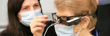 Consultant and patient wearing equipment that allows them to detect signals in their blind eye