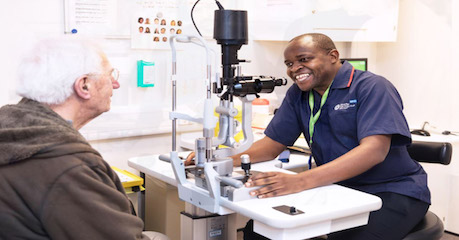 Photo of patient chatting with Moorfields staff member