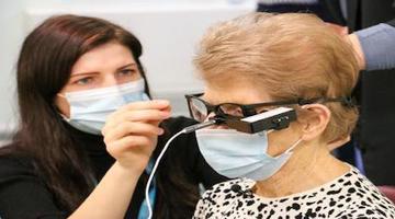 Patient getting artificial eye fitted