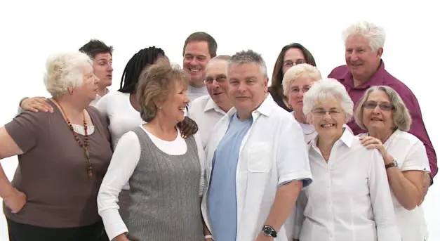 Group of people standing close together