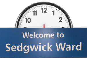 Welcome to Sedgwick Ward sign with half a clock above it
