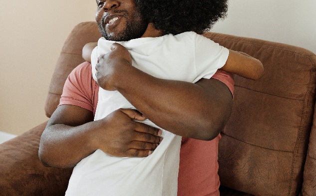A man hugging a child