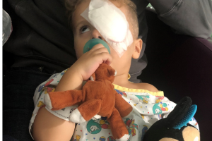 Image of a child with a patch over their eye
